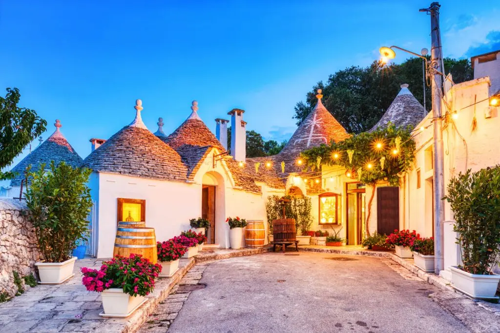 White trulli houses with distinctive roofs in Alberobello near Bari, Italy.